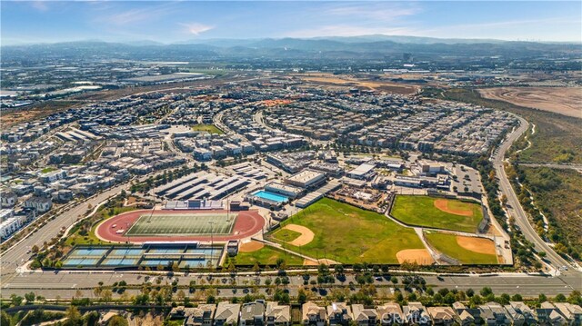 birds eye view of property with a mountain view
