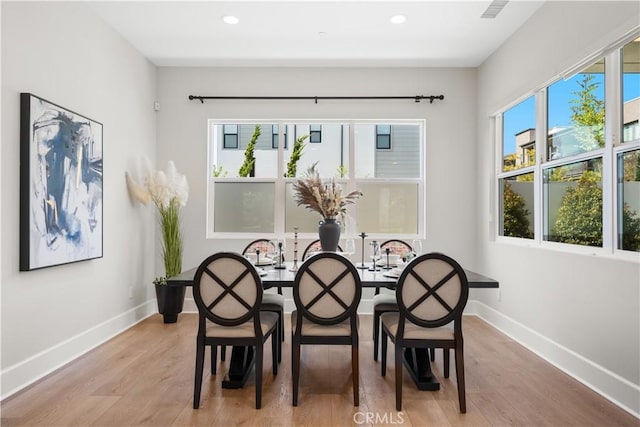 dining space with recessed lighting, baseboards, visible vents, and light wood-type flooring