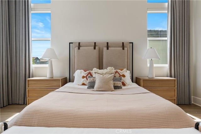 bedroom with wood finished floors