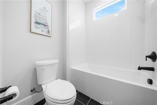 bathroom with tile patterned floors, toilet, and shower / tub combination