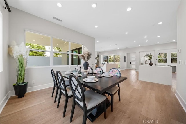 dining space with recessed lighting, baseboards, visible vents, and light wood finished floors