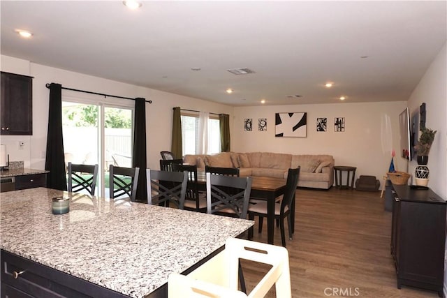 1322 Division Ct, Hemet, CA 92543 - kitchen with open floor plan, wood finished floors, light stone countertops, and recessed lighting