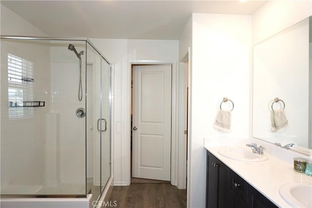 1322 Division Ct, Hemet, CA 92543 - bathroom featuring a stall shower, wood finished floors, and double vanity