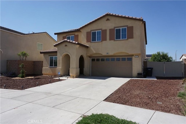 1322 Division Ct, Hemet, CA 92543 - mediterranean / spanish house with stucco siding, a garage, a tile roof, and concrete driveway