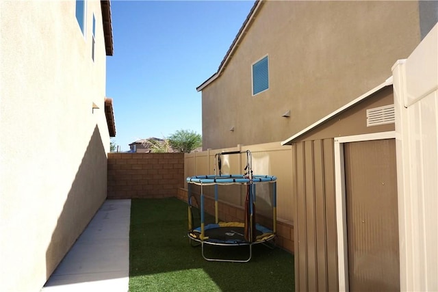 1322 Division Ct, Hemet, CA 92543 - fenced backyard with a trampoline