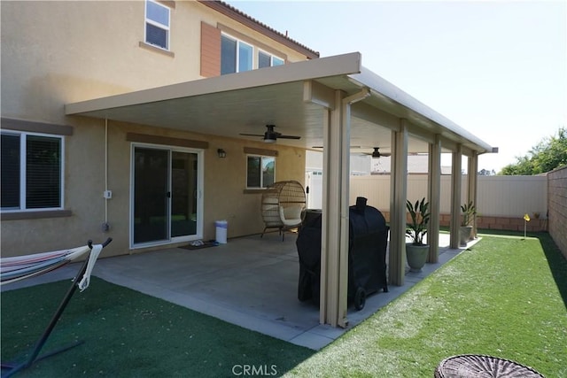 1322 Division Ct, Hemet, CA 92543 - back of house with ceiling fan, stucco siding, a fenced backyard, and a patio area