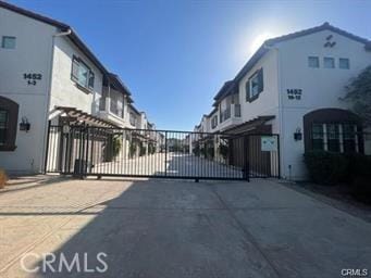 view of gate featuring a residential view