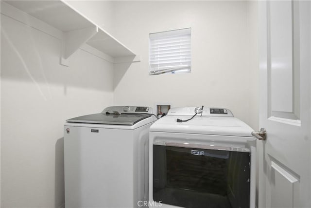clothes washing area featuring laundry area and independent washer and dryer