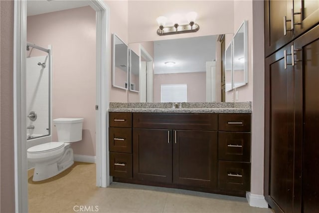 bathroom featuring toilet, baseboards, shower / washtub combination, and vanity