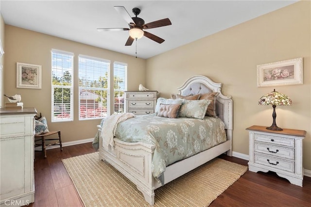 bedroom featuring baseboards, dark wood-style floors, and ceiling fan
