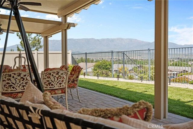 sunroom / solarium with a mountain view