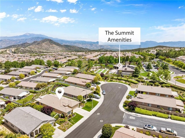 drone / aerial view featuring a residential view and a mountain view