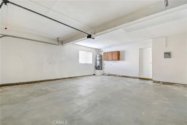 542 W Grand Ave, Pomona, CA 91766 - garage with water heater and a garage door opener