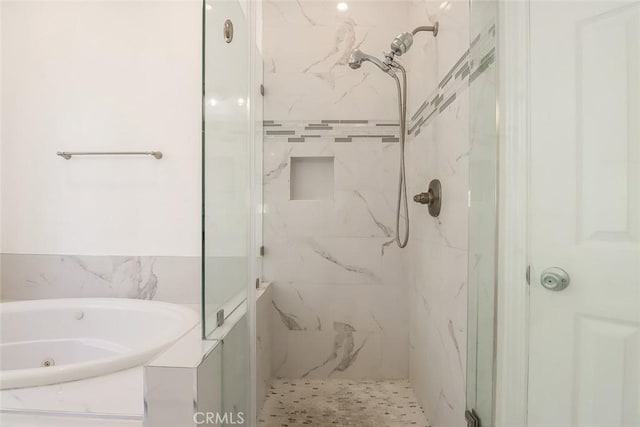 full bathroom with a jetted tub and a marble finish shower