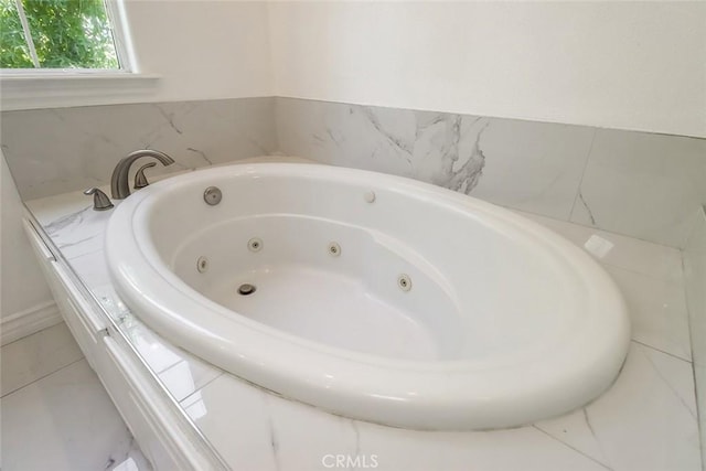 bathroom featuring a whirlpool tub