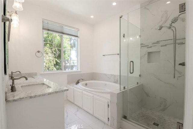 full bathroom with a sink, a marble finish shower, marble finish floor, recessed lighting, and a garden tub