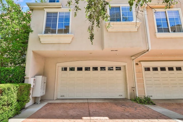 garage featuring driveway