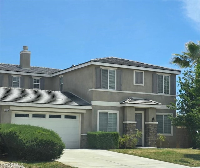 39294 Butler St, Palmdale, CA 93551 - view of front of house featuring stucco siding, concrete driveway, and stone siding