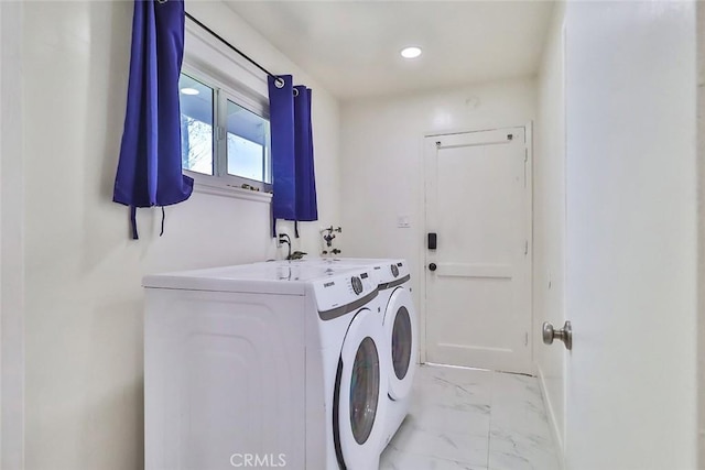 laundry area featuring washing machine and clothes dryer, recessed lighting, laundry area, and marble finish floor