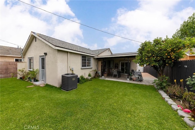 12005 Washington Blvd, Whittier, CA 90606 - rear view of property with central AC unit, stucco siding, and a patio area