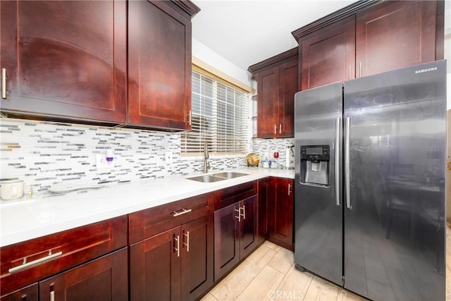 12005 Washington Blvd, Whittier, CA 90606 - kitchen with stainless steel fridge, a sink, dark brown cabinets, and light countertops