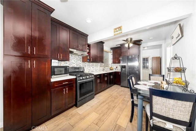 12005 Washington Blvd, Whittier, CA 90606 - kitchen featuring appliances with stainless steel finishes, light wood-style flooring, tasteful backsplash, light countertops, and a ceiling fan