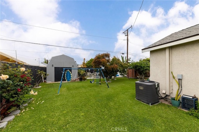 12005 Washington Blvd, Whittier, CA 90606 - view of yard featuring a storage shed, a playground, central AC unit, and an outbuilding