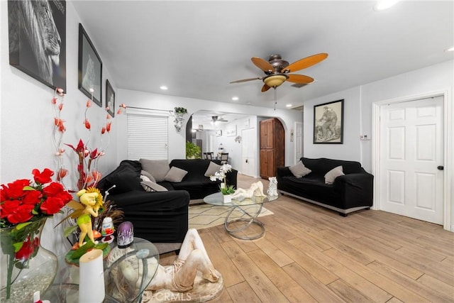 12005 Washington Blvd, Whittier, CA 90606 - living room with a ceiling fan, light wood finished floors, arched walkways, and recessed lighting