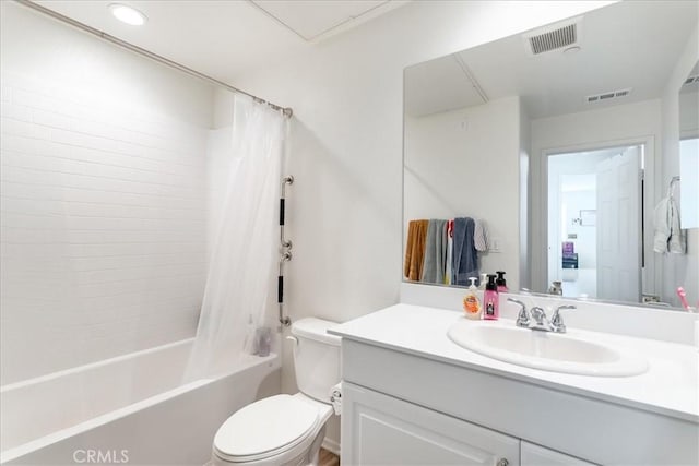 bathroom with vanity, toilet, visible vents, and shower / tub combo with curtain