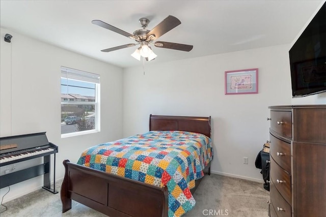 bedroom with carpet flooring, a ceiling fan, and baseboards