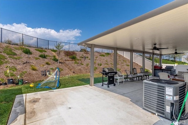view of patio / terrace with fence, area for grilling, a ceiling fan, central AC unit, and a hot tub