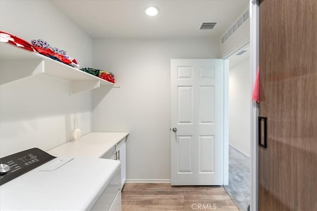laundry room featuring visible vents, baseboards, washer / dryer, light wood-style floors, and recessed lighting
