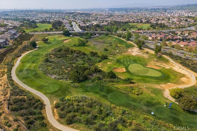 aerial view with golf course view and a residential view