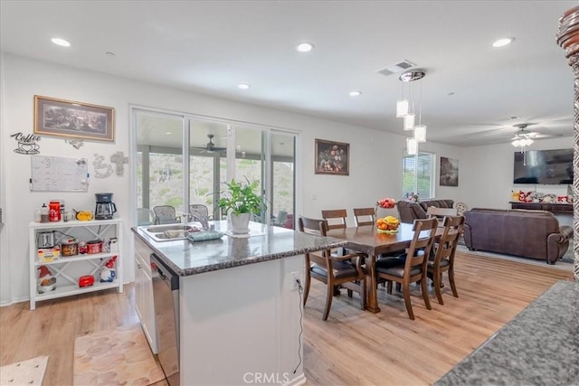 dining area with light wood-style floors, ceiling fan, and recessed lighting