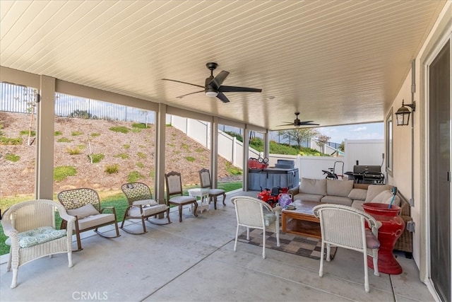 view of patio / terrace featuring grilling area, a ceiling fan, a fenced backyard, and an outdoor hangout area