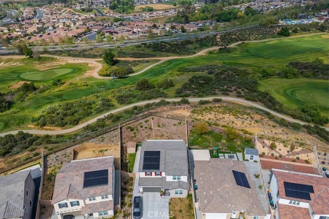 birds eye view of property featuring view of golf course and a residential view
