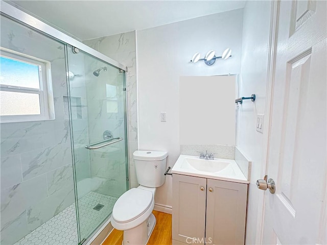 4709 Bresee Ave, Baldwin Park, CA 91706 - full bath featuring wood finished floors, toilet, a marble finish shower, and vanity