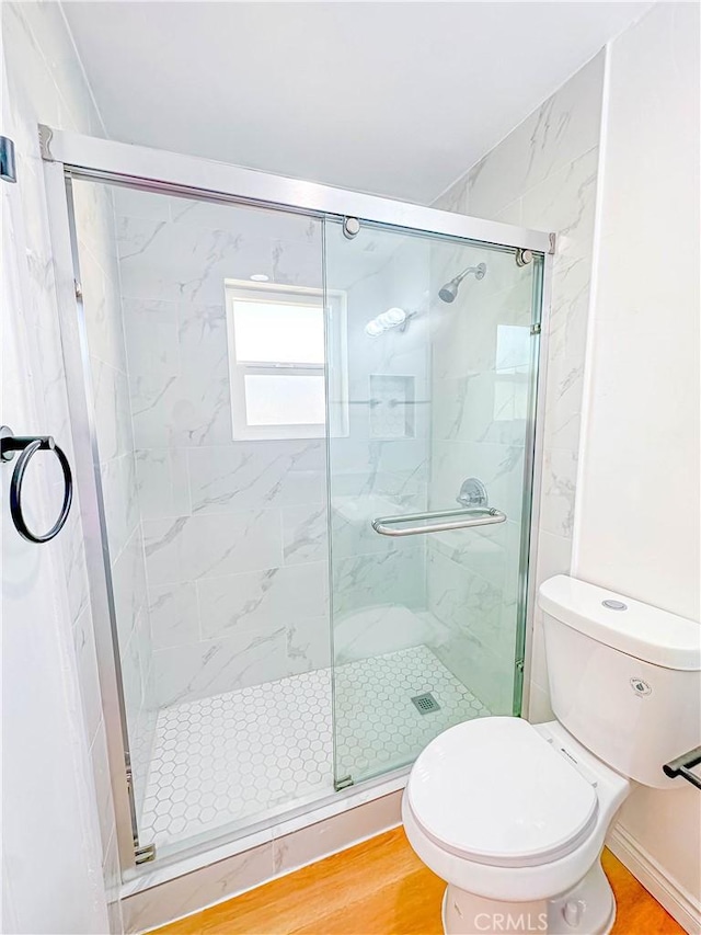 4709 Bresee Ave, Baldwin Park, CA 91706 - bathroom featuring wood finished floors, a stall shower, and toilet