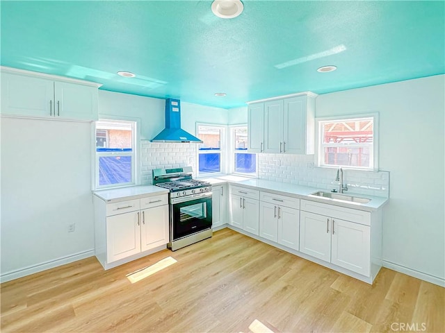 4709 Bresee Ave, Baldwin Park, CA 91706 - kitchen with extractor fan, light countertops, tasteful backsplash, a sink, and gas stove