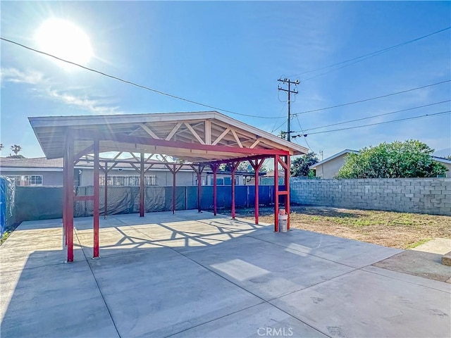 4709 Bresee Ave, Baldwin Park, CA 91706 - view of patio / terrace with a fenced backyard, a detached carport, and driveway