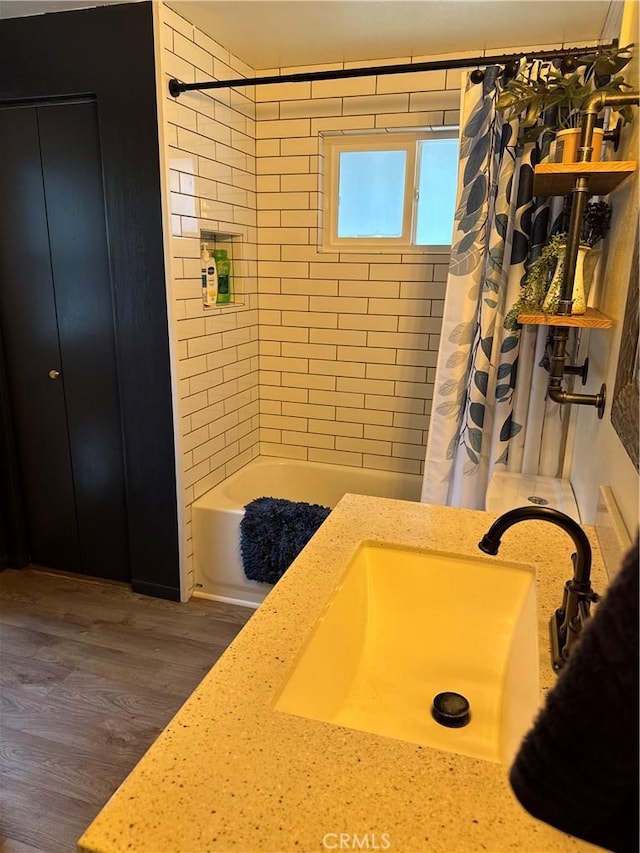 31347 Oakleaf Dr, Running Springs, CA 92382 - bathroom with a sink, wood finished floors, and shower / bath combination with curtain