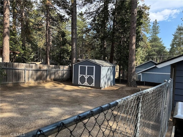31347 Oakleaf Dr, Running Springs, CA 92382 - view of shed with a fenced backyard