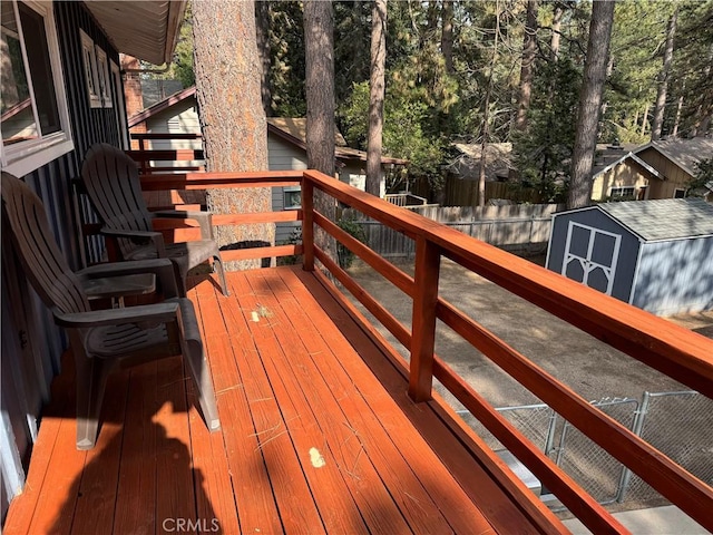 31347 Oakleaf Dr, Running Springs, CA 92382 - deck with a storage unit, a fenced backyard, and an outbuilding