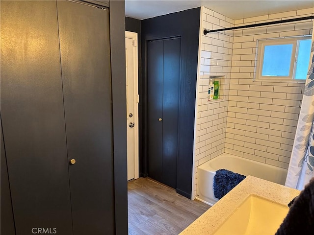 31347 Oakleaf Dr, Running Springs, CA 92382 - bathroom with a closet, wood finished floors, and shower / bath combination with curtain