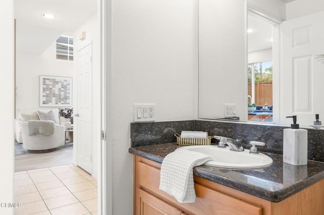 bathroom with tile patterned floors and vanity
