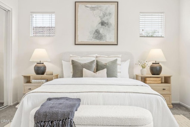 carpeted bedroom with baseboards