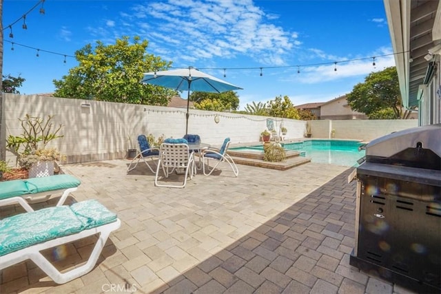4433 E Justice Cir, Orange, CA 92869 - view of patio / terrace featuring a fenced backyard, a fenced in pool, and outdoor dining area