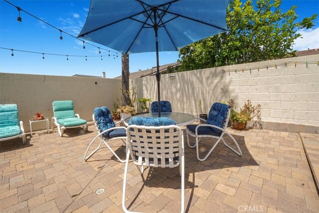 4433 E Justice Cir, Orange, CA 92869 - view of patio with a fenced backyard and outdoor dining area