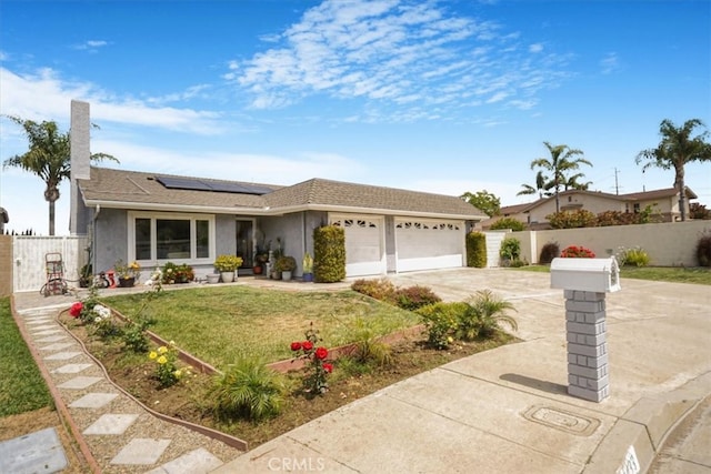 4433 E Justice Cir, Orange, CA 92869 - ranch-style home with roof mounted solar panels, a garage, stucco siding, a front lawn, and concrete driveway