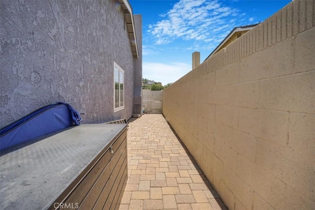 4433 E Justice Cir, Orange, CA 92869 - view of side of home with fence, stucco siding, and a patio area
